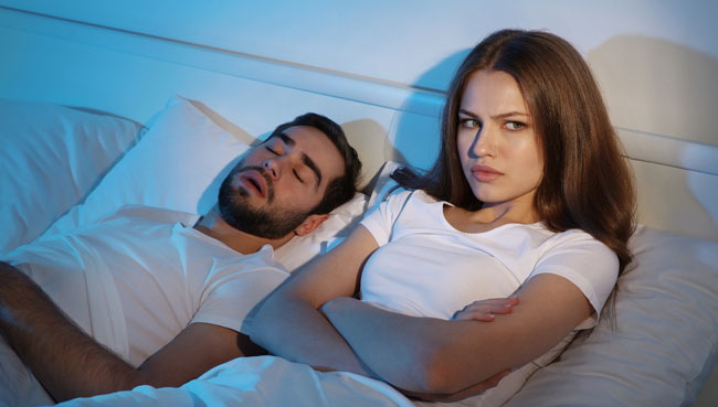 Young girl can't sleep because of her man's snoring